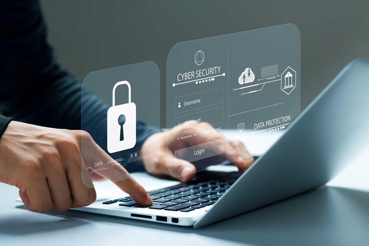 Man at laptop with floating lock symbol